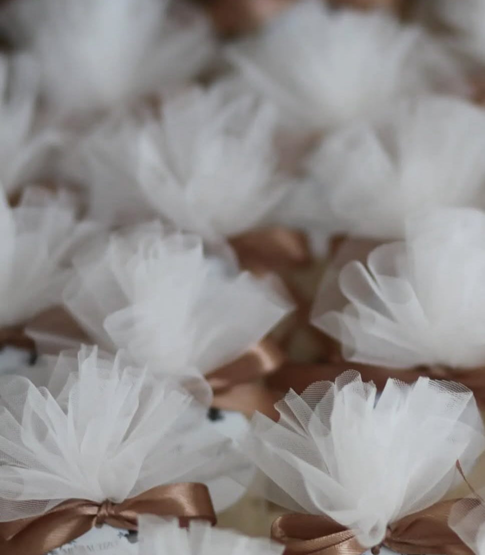 25 Teddies on coaster wrapped with tulle and bow finish